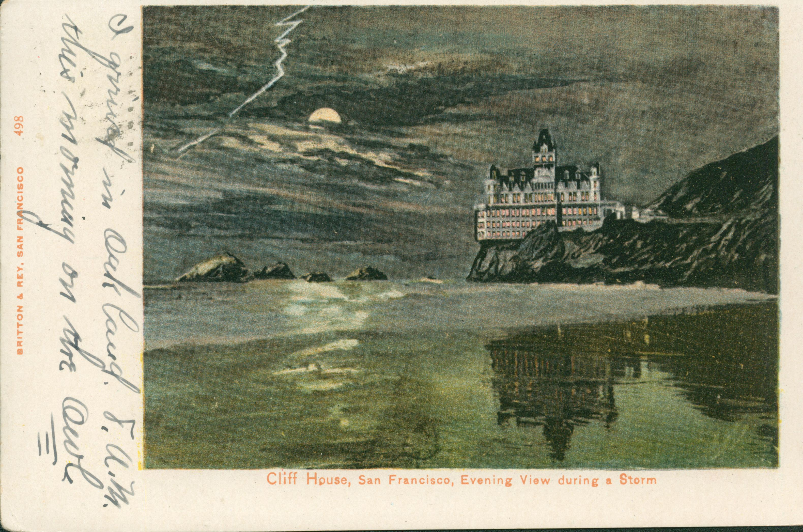 Shows the Cliff House and Seal Rocks at night with the beach in the foreground.